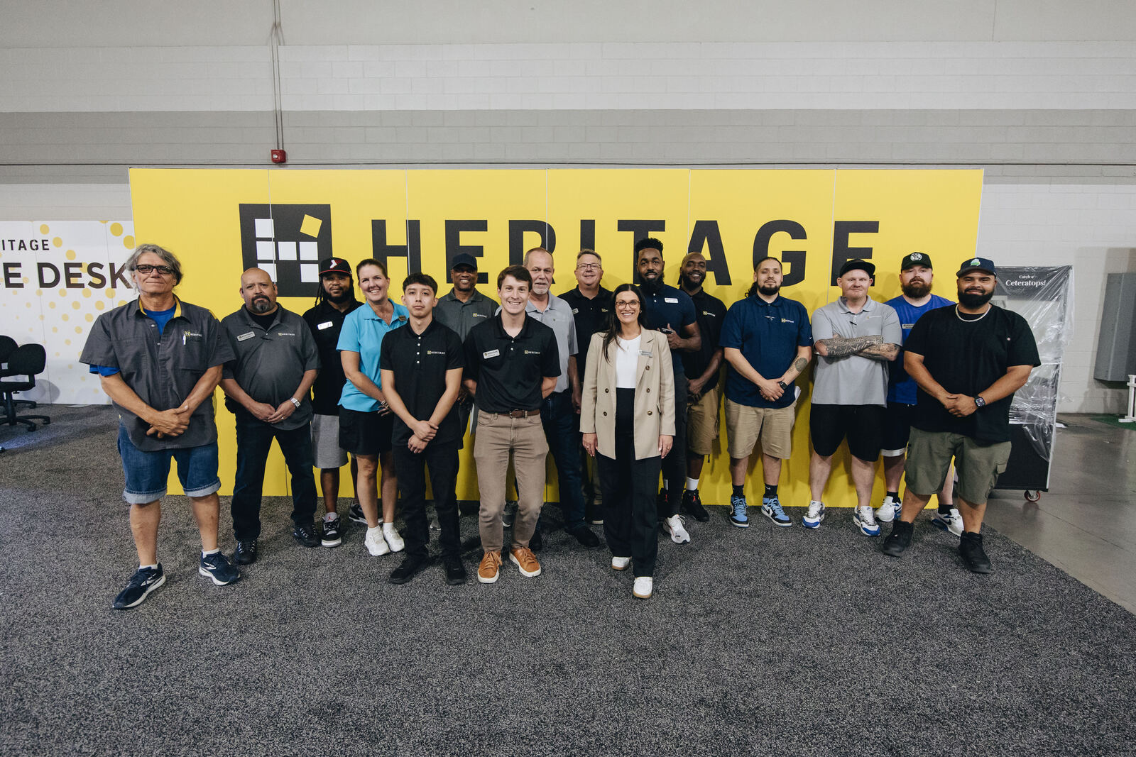The full event crew at a yellow wall